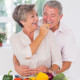 Mature couple eating in kitchen