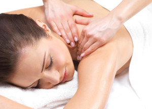 Close-up of a young woman receiving back massage at spa