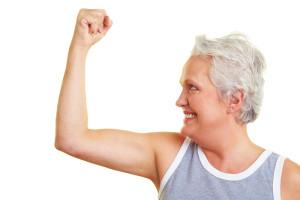 Older woman flexing muscles