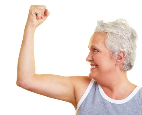 Older woman flexing muscles