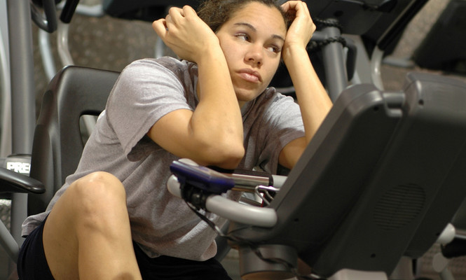 Girl bored on rowing machine