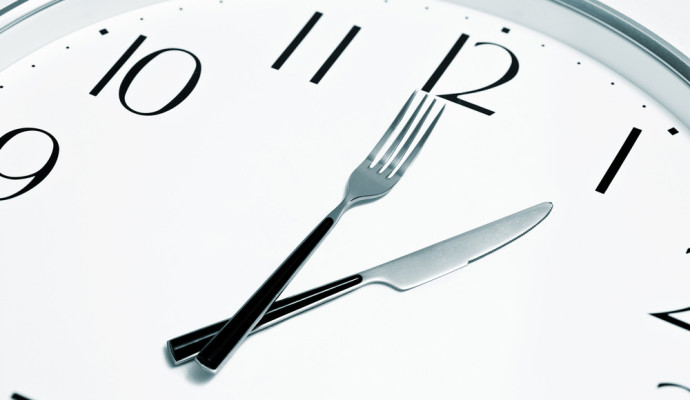 Clock with knife and fork as hands
