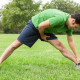 Man stretching in park