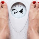 Women's feet on scales with palm tree and Christmas tree