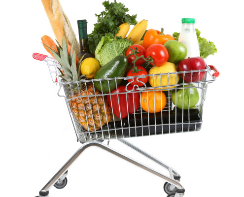 Shopping trolley full of fresh fruit and vegetables