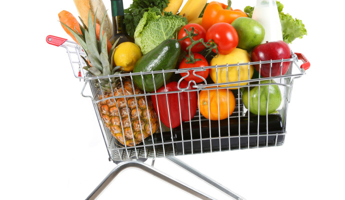 Shopping trolley full of fresh fruit and vegetables