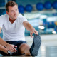 Man stretching in gym