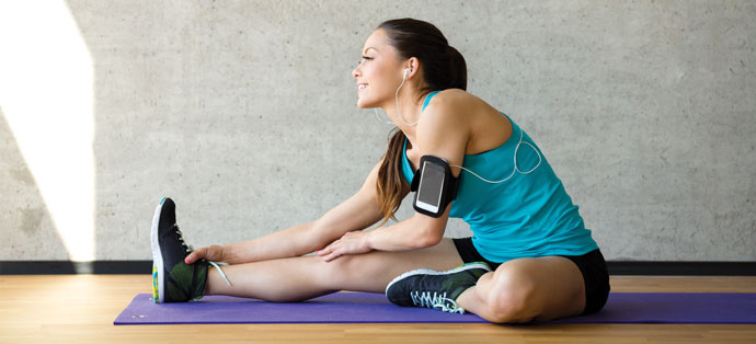Girl-stretching-with-iPod