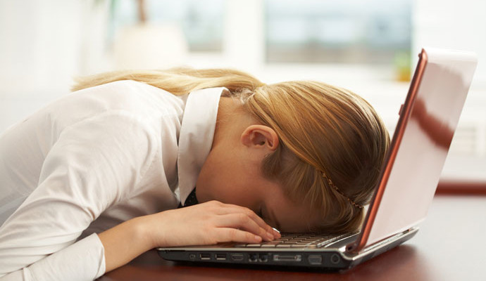 woman asleep at laptop