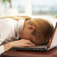 woman asleep at laptop