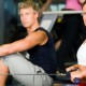 Man and woman rowing in gym